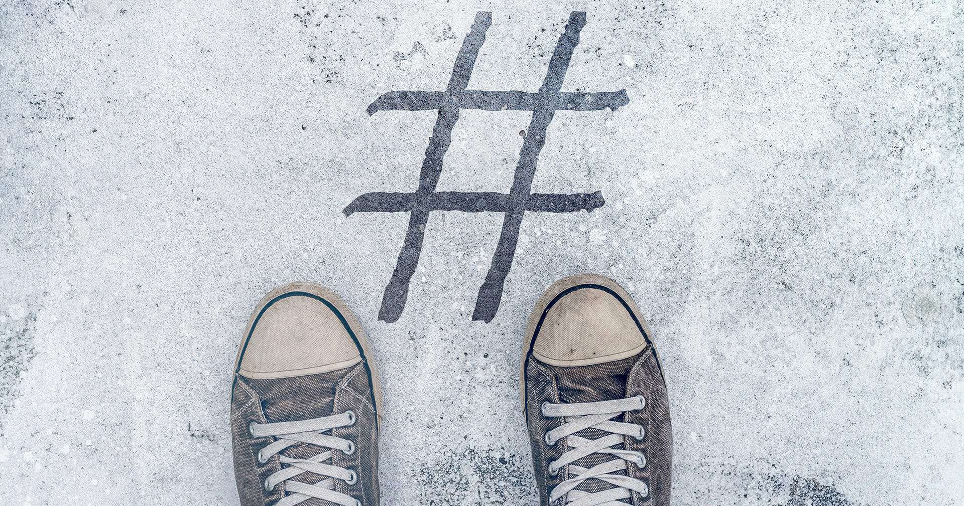 Use-it-or-lose-it-featured-image-feet-standing-over-hashtag-imprint-on-street
