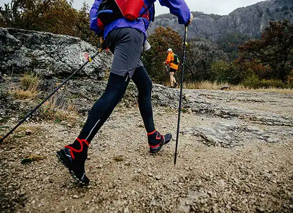 feet-man-hikers-with-walking-poles