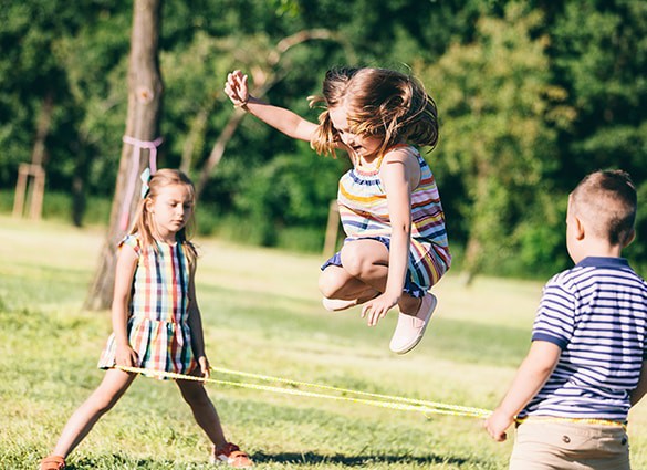 little-girl-jumping-through-the-elastic-playing