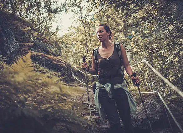 woman-hiker-with-backpack-walking-on-the-wild