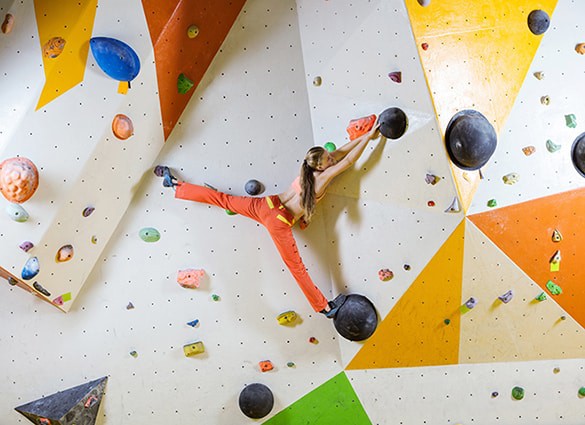 young-woman-climbing-bouldering-route-1